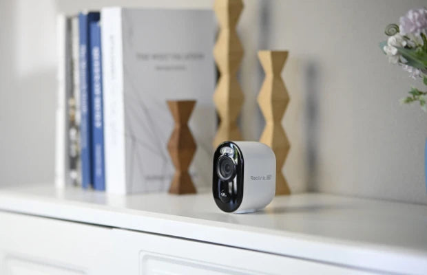 Reolink Argus 3 Ultra 4K Battery/Solar-Powered Standalone WiFi Camera with Color Night Vision mounted indoors on desk for maximum portability