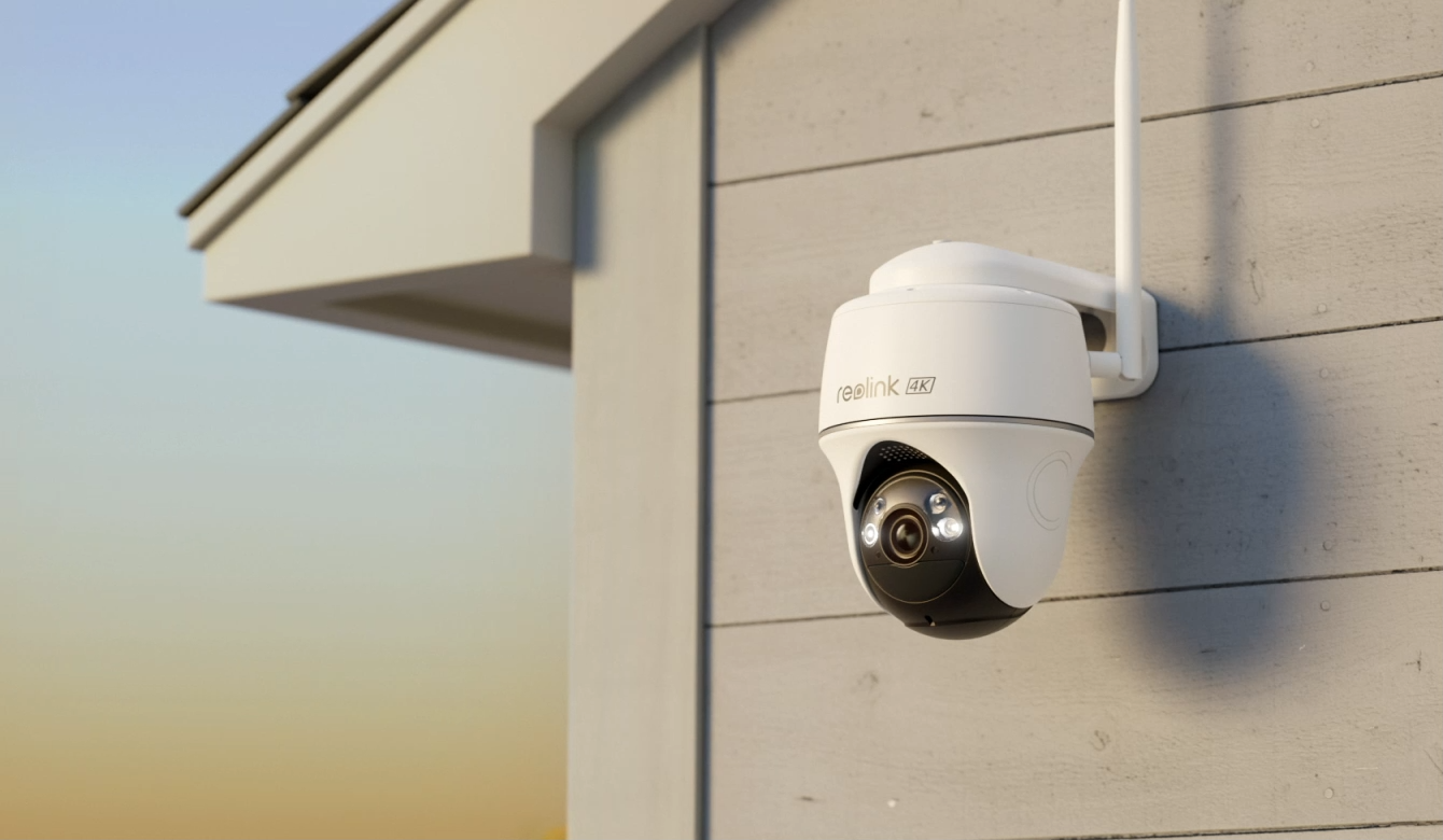 Reolink Argus PT Ultra 4K 8MP Wireless Pan & Tilt Standalone Solar/Battery Camera with Spotlights mounted on external wall emitting white line