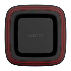 A square black electronic device with rounded corners, featuring a red striped border and the word 'AJAX' printed in gray in the center, shown against a plain white background. there are 3 lights one in red yellow and green, at the top of the face