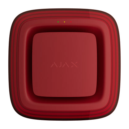 A square AJAX VAD sounder front view on a solid white background. The device features a glossy deep red front face with the AJAX logo in the center, a series of three small LED indicator lights near the top edge, and a thick, rounded outer frame with subtle dark red concentric stripes.