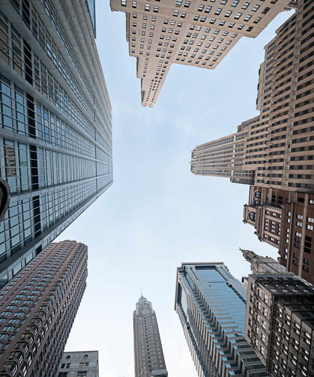 portrait Cityscape with tall buildings under a clear blue sky