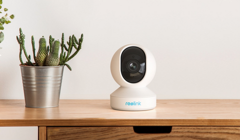 Reolink E1 Zoom 5MP Smart PTZ WiFi Indoor Camera with cactus decoration on desk 