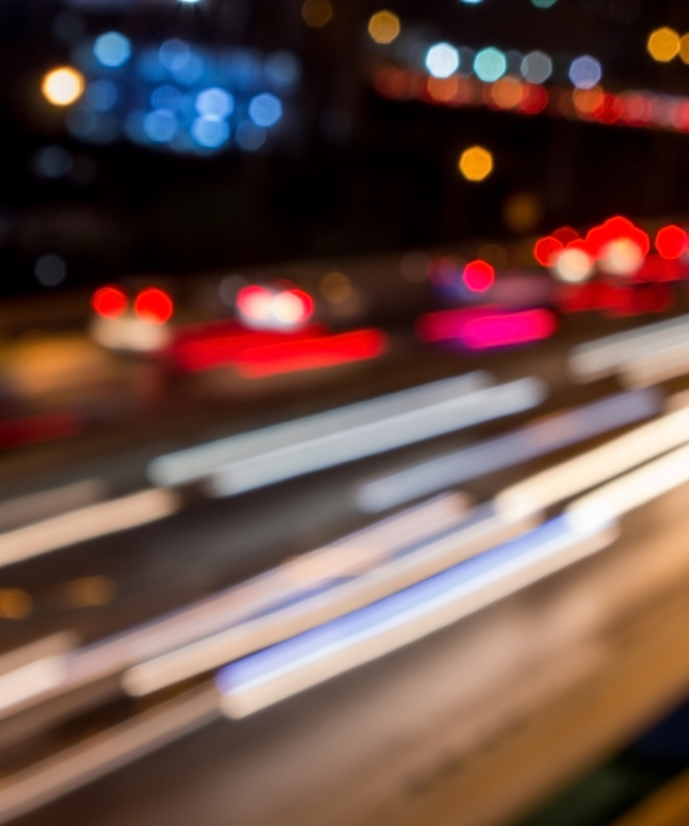 Blurred city lights at night with a focus on bokeh effect