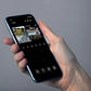 hand holding mobile phone, on the phone is the reolink cctv app