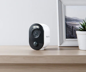 Reolink Argus 3E 3MP Wireless Solar & Battery Powered Security Camera with Smart Detection sitting indoors on table