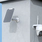 Reolink Argus PT 5MP Wireless Solar Battery Camera with Pan & Tilt mounted on wall plugged into solar panel for constant power