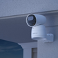 Reolink Argus Track 4K Dual-Lens Wi-Fi Solar/Battery Camera with Auto-Zoom Tracking on front porch at night