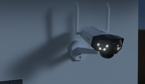 Reolink Duo 2(Battery) 4K 180° Panoramic Solar/Battery-Powered Wi-Fi Camera at night emitting white spotlight