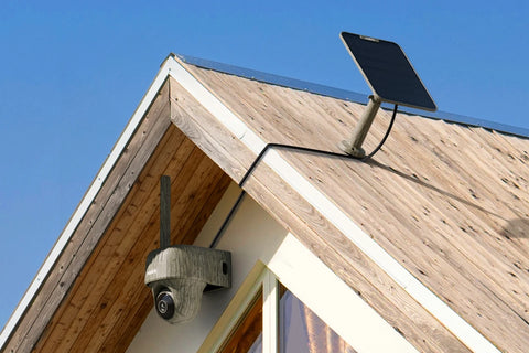 Reolink Go Ranger PT First 4K 4G LTE Wildlife Camera with 360° All-Around View ounted to extewrnal wall with solar panel on the roof