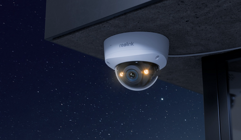 Reolink RLC-1240A 12MP IK10 Vandal Proof Wide FOV Security Camera at night emitting  warm light for colour night vision