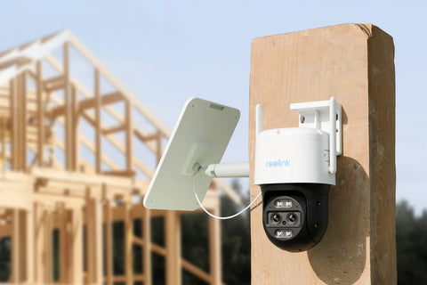 Reolink TrackMix LTE 4G LTE Dual-Lens Battery Security Camera with Auto-Zoom Tracking on wooden post looking over construction site