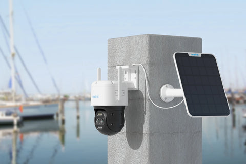 Reolink TrackMix LTE 4G LTE Dual-Lens Battery Security Camera with Auto-Zoom Tracking on concrete post with solar panel looking over dockyard