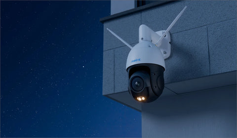 RLC-823S1W
4K Dual-Band Wi-Fi 6 PTZ Security Camera with 360° All-Around Protection on external brick wall, at night emitting a white light. 