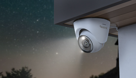 Reolink RLC-1224A 12MP UHD PoE Camera with Color Night Vision outside on front porch emitting spotlight 