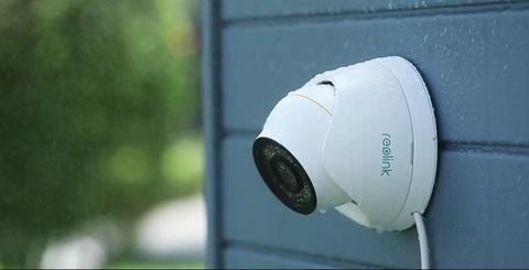 Reolink RLC-1224A 12MP UHD PoE Camera with Color Night Vision displaying IP67 weatherproofing in the rain