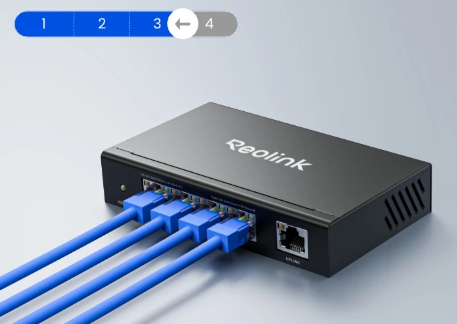 Reolink network switch with blue cables on a light gray background