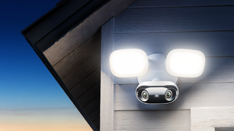 reolink elite wifi panoramic security camera with flood lights on a house wall