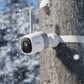 Reolink altas Security camera attached to a tree with a secure strap in a snowy forest