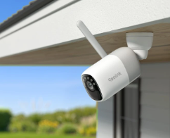 Reolink altas security camera attached to an exterior ceiling with clear sky background