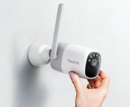 Reolink altas security camera being put onto a wall indoors