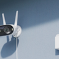 Reolink Elite WIFI camera with antenna plugged into socket on a wall  