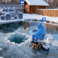 Person ice fishing with a dog on a frozen lake near a wooden cabin. there is a white detection box around the person, the dog and the car