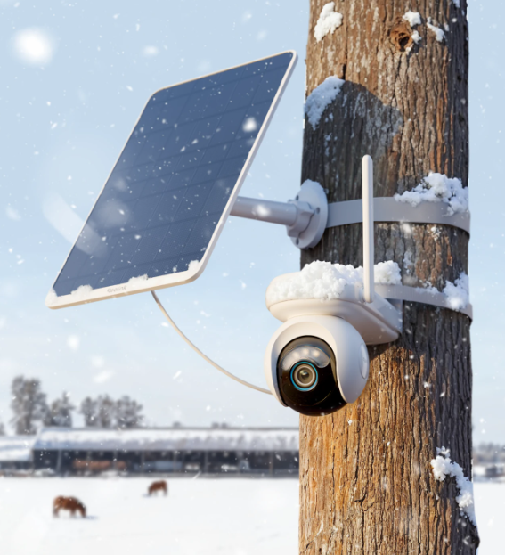 Reolink Altas Go PT Security camera with solar panel attached to a tree in a snowy landscape