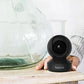 Reolink E1 Pro Just the Right Amount of Everything for Indoor PT Cam on side table next to glass decoration. 
